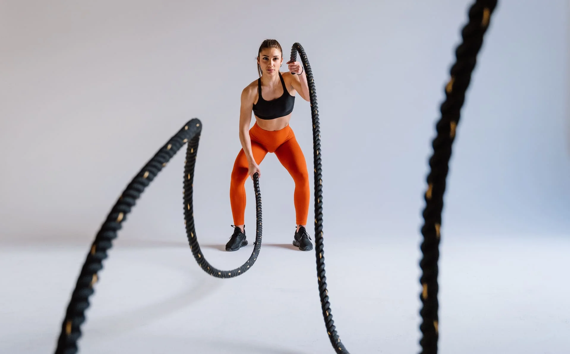 Female athlete training, representing GHM Consultancy's brand identity work for premium fitness and wellness brands in the GCC